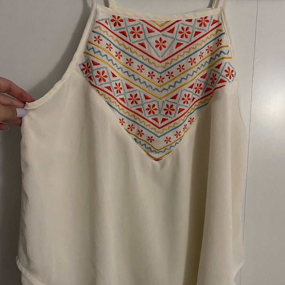 Spaghetti strap silk shirt.